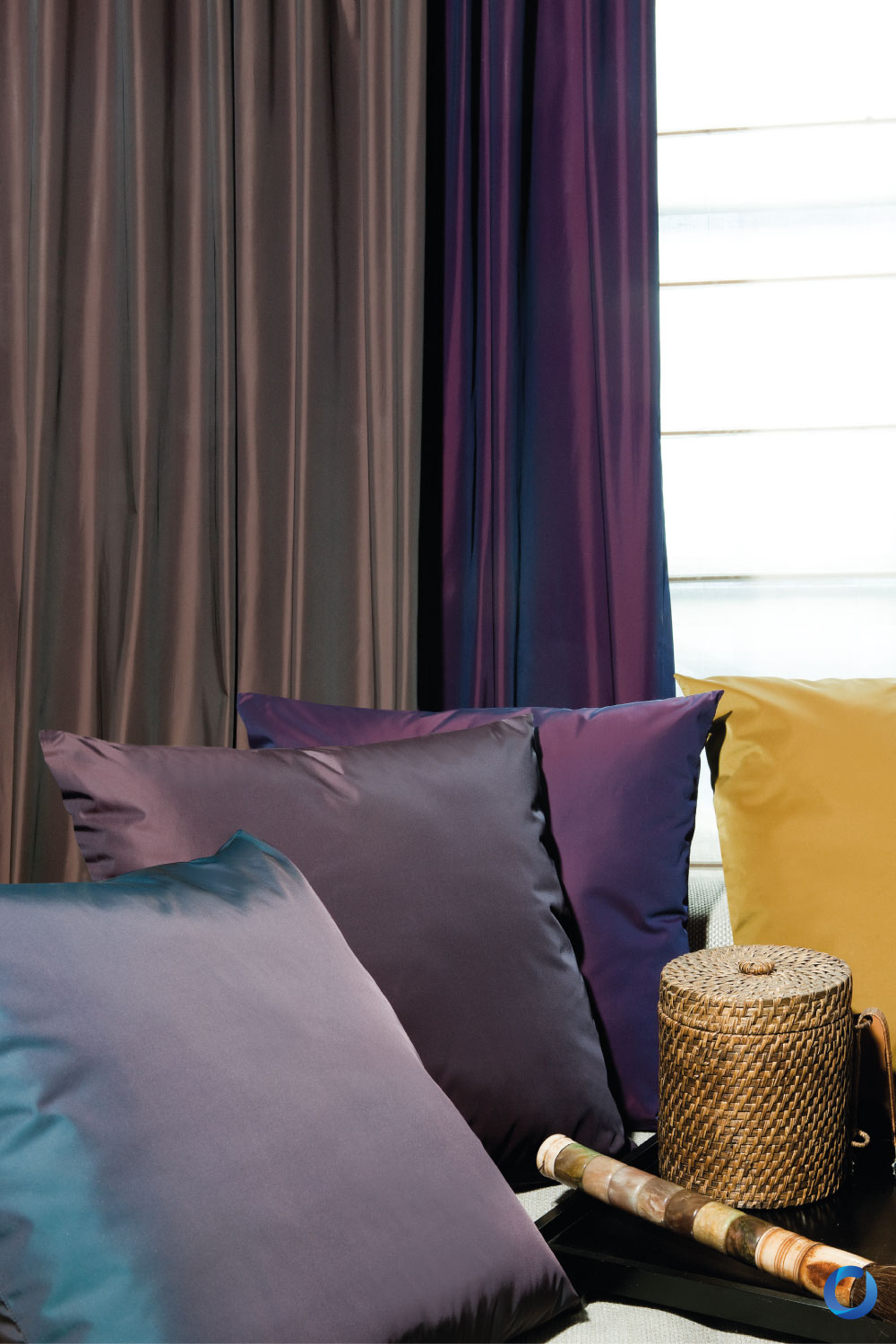 Close-up of satin cushions and purple curtains. Collection Runway