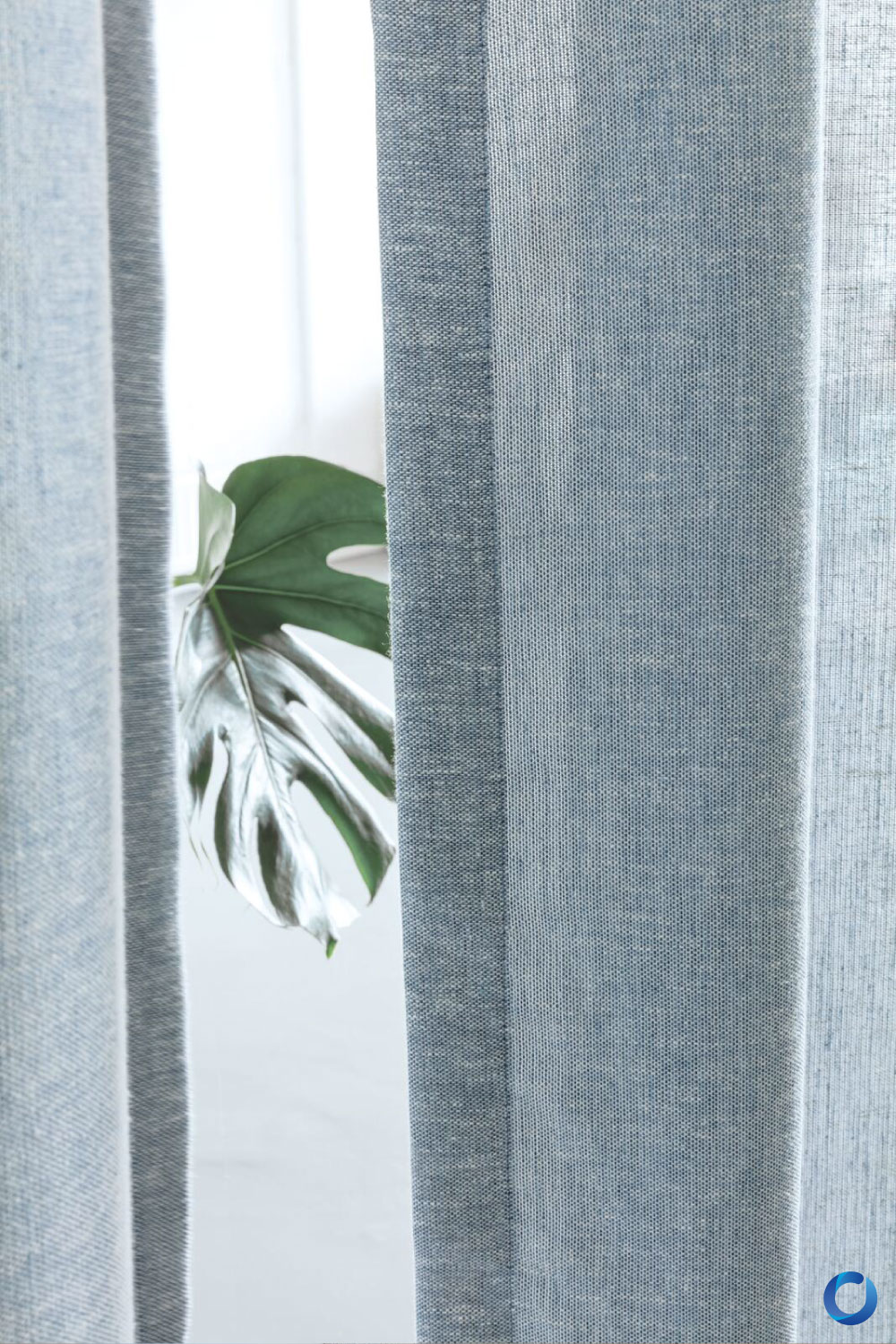 Close-up textured curtain fabric with natural light filtering. Collection Goa