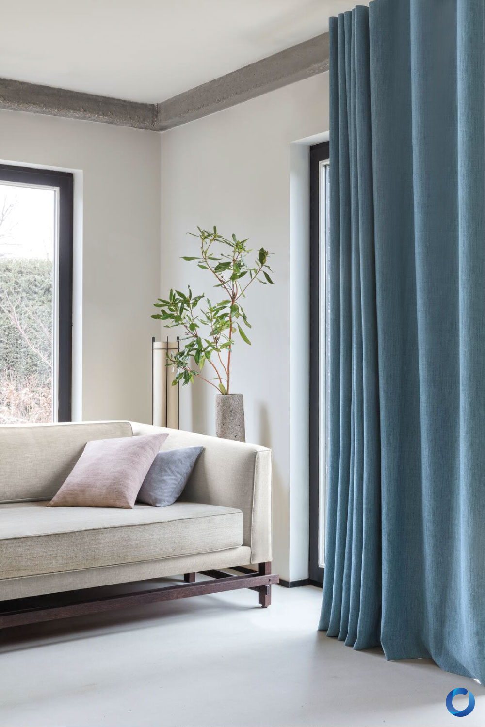 Modern living room with blue curtains and neutral sofa. Collection Jadore