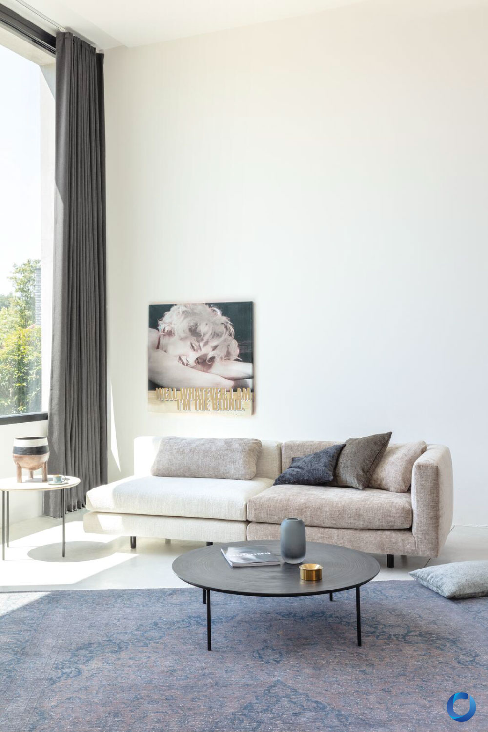 Bright living room with dark curtains and cozy neutral sofa. Collection Monsieur