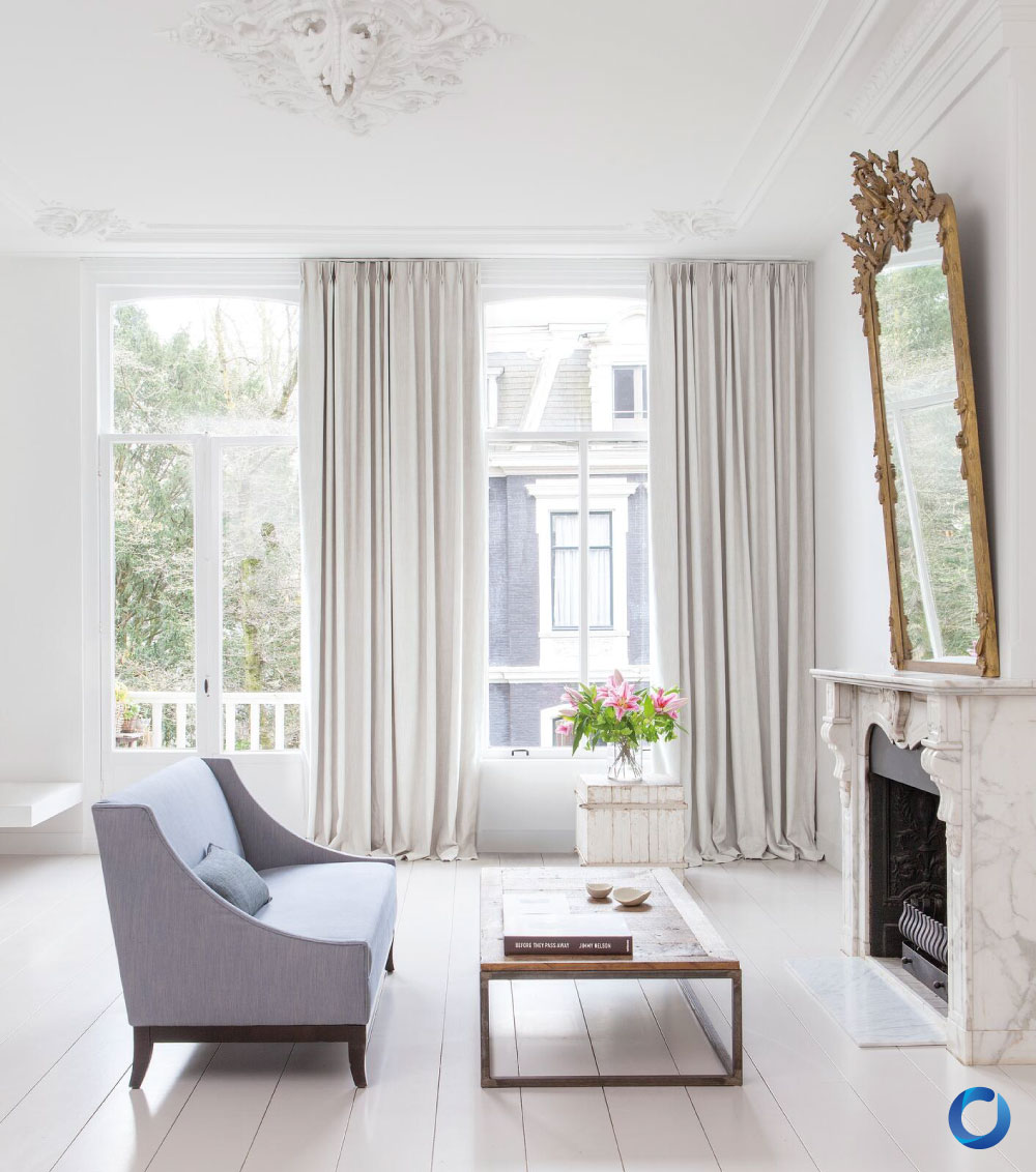 Bright classic living room with cream curtains and vintage decor. Collection Zia