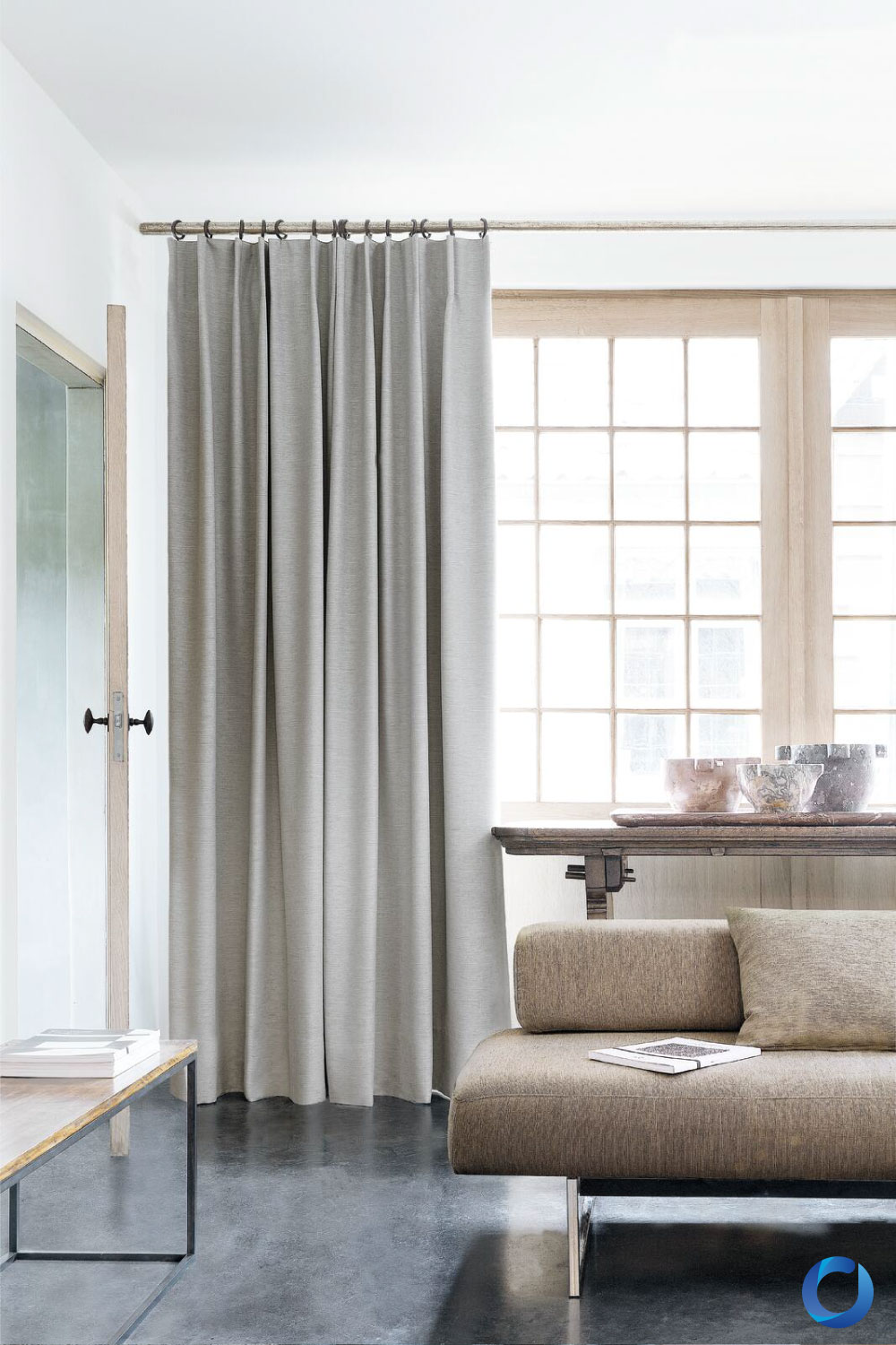 Minimalist living room with grey curtains and modern neutral sofa. Provence Collection