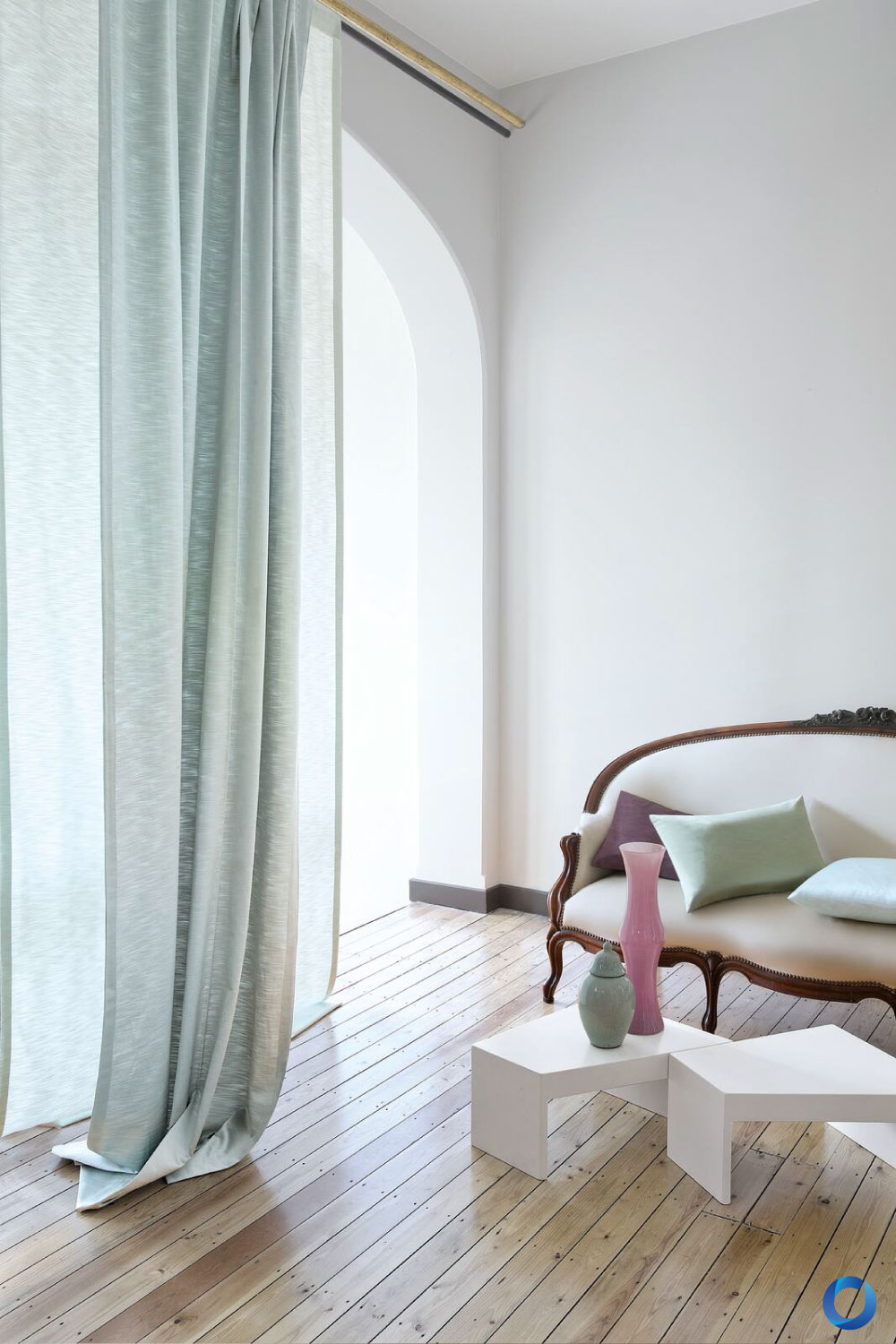 Bright interior with sheer pastel curtains and vintage sofa. Raider Collection