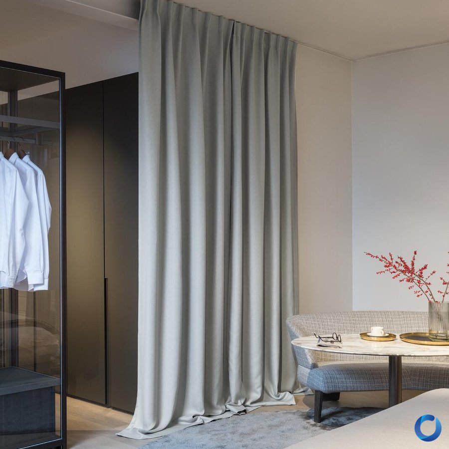 Grey dim-out curtain used as room divider in a luxury bedroom, Juno design from Night Sky collection by Acacia Fabrics