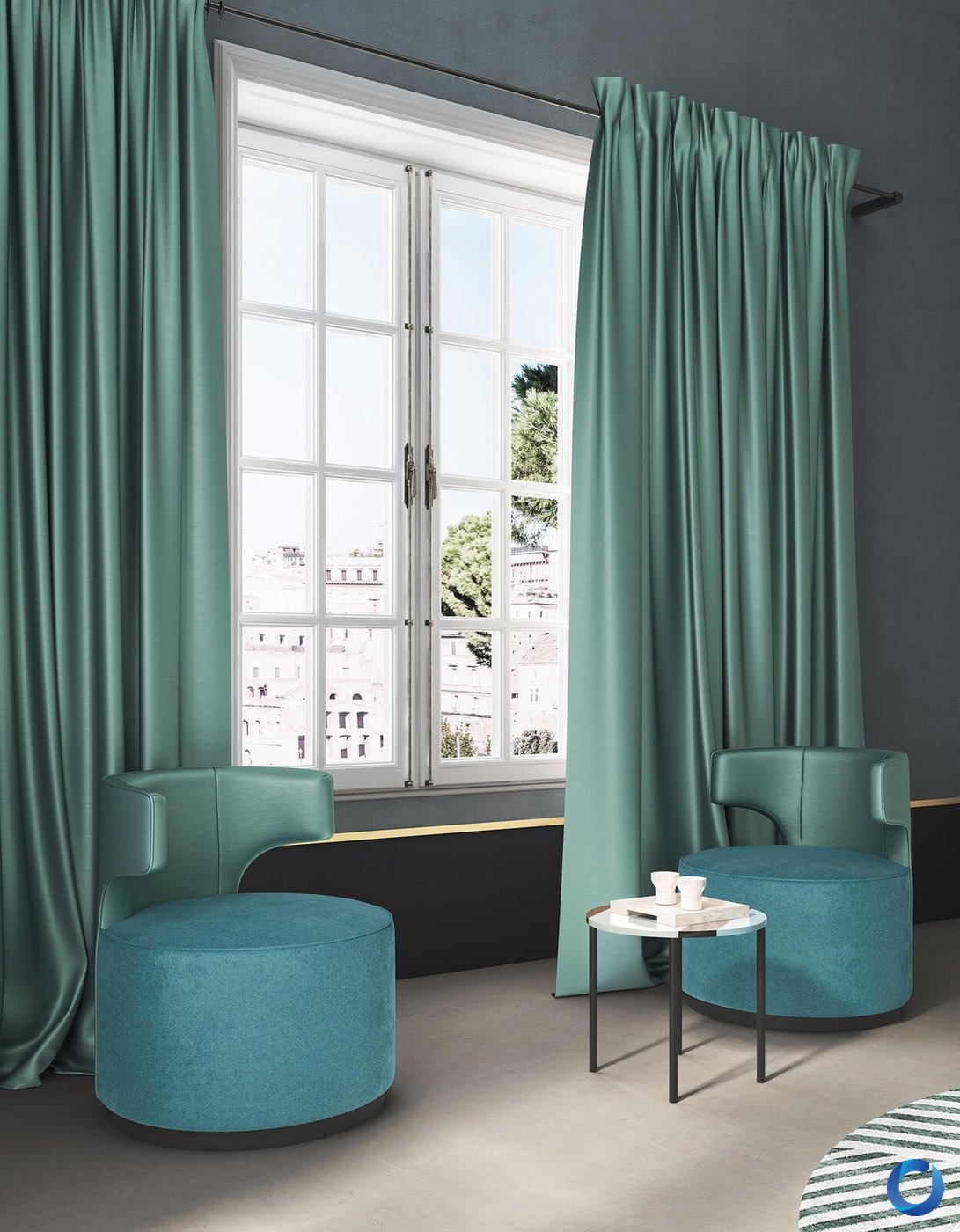 Teal silk curtains framing a window with matching teal velvet armchairs and ottoman, Acacia Raider collection