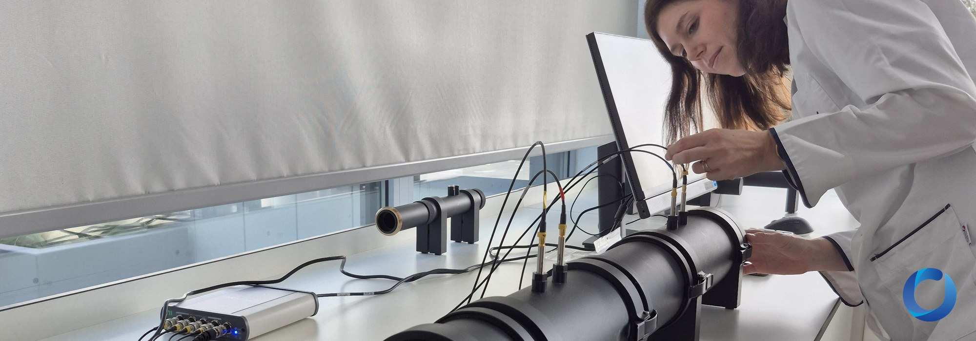 Banner: fabric sound absorption testing with impedance tube in acoustic laboratory - Acacia Fabrics