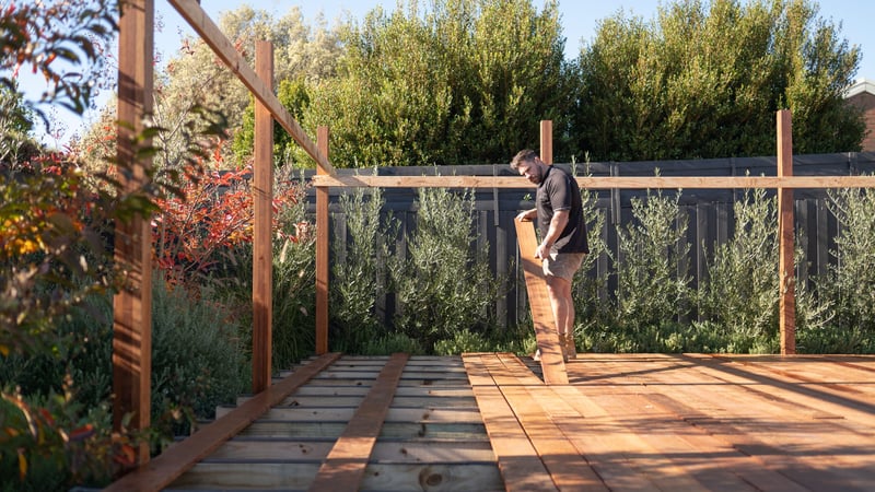 Laying down deck boards ensuring proper fit