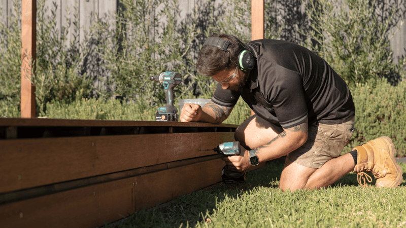 Installing plinth boards around the perimeter of the deck