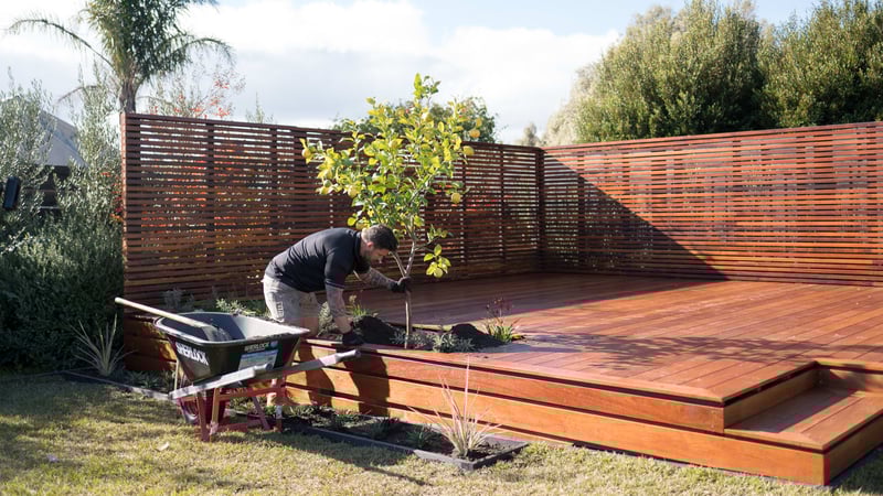Adding plants to the deck as final decorative features