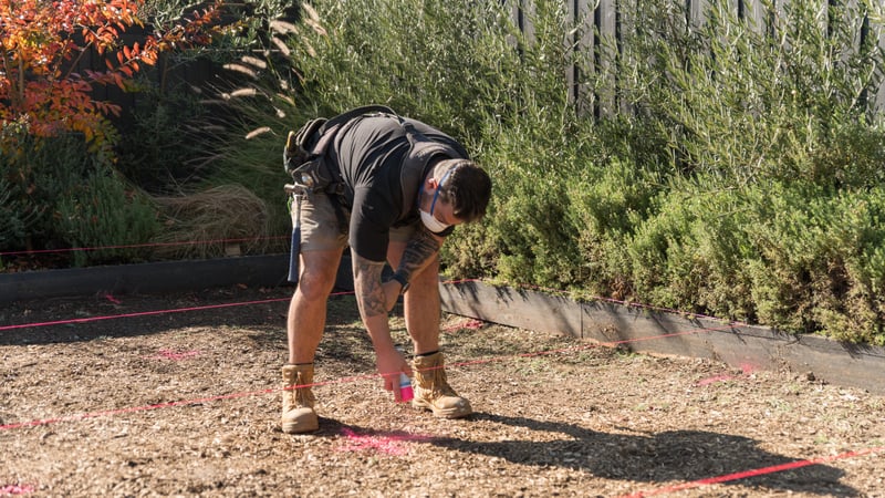 Marking the stumps placement with spray paint