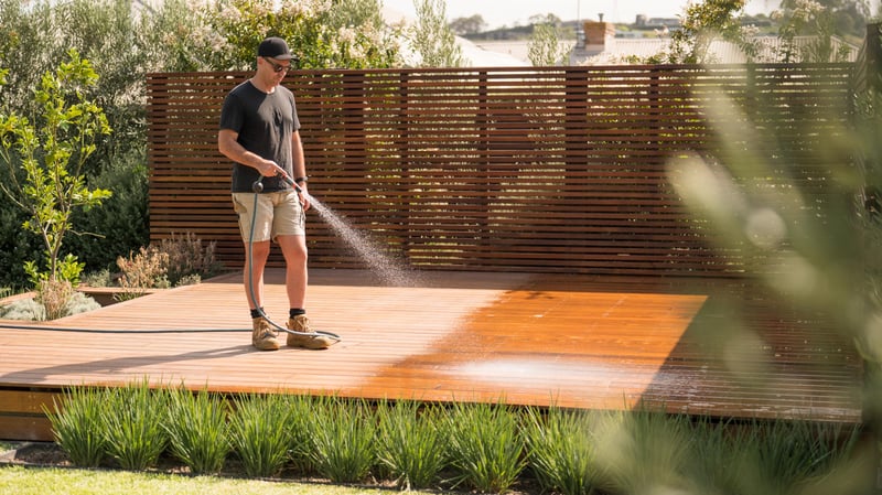 man cleaning deck.