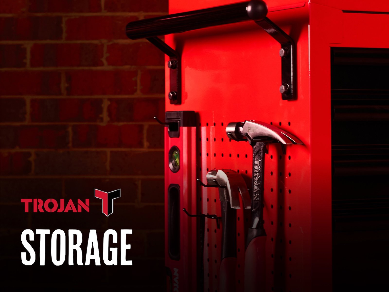 Red Trojan storage unit with tools hanging on it with the text "Storage" in the foreground