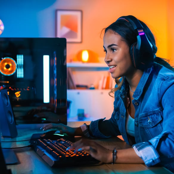 girl teen gaming on computer