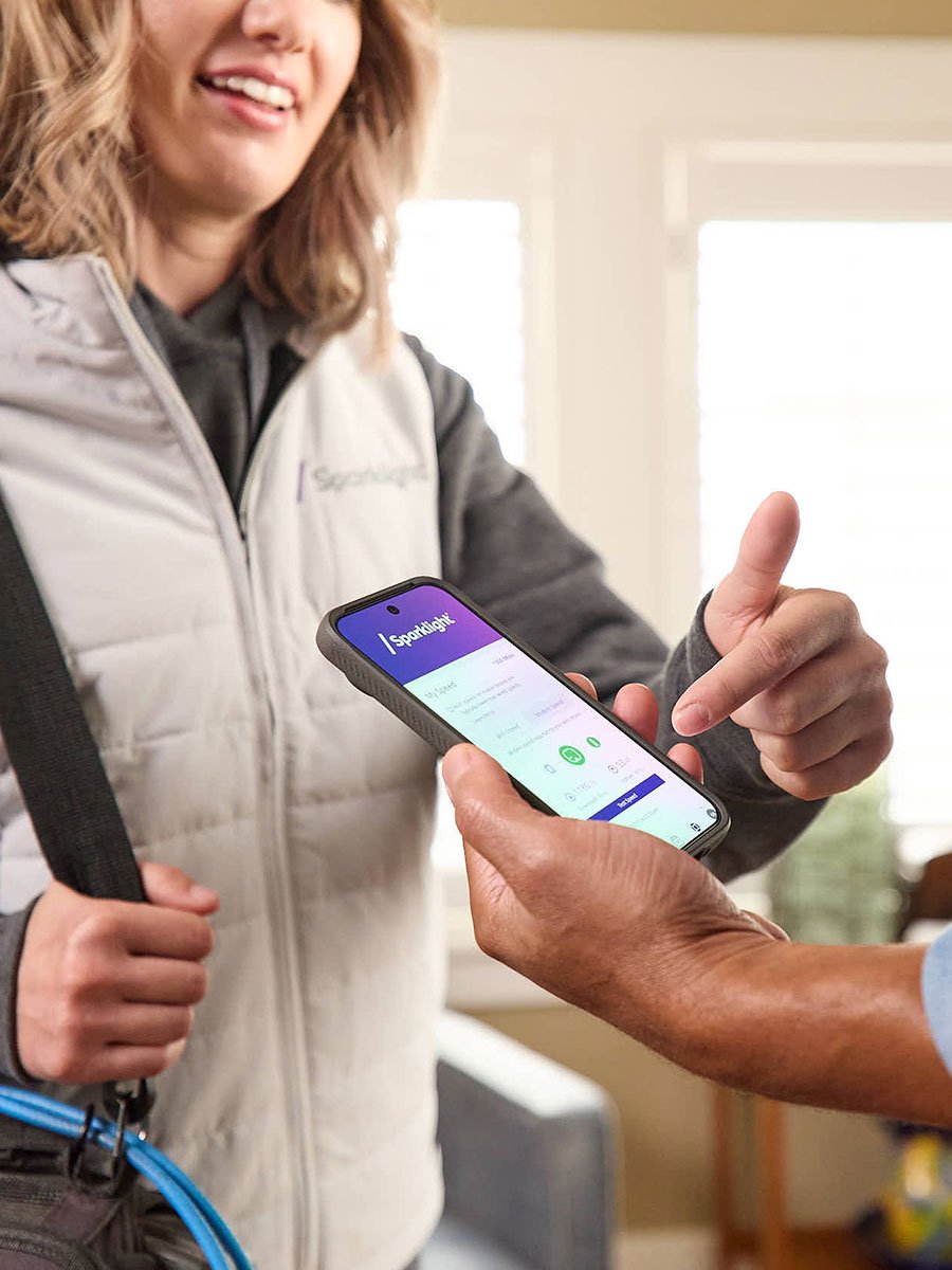 women pointing to mobile
