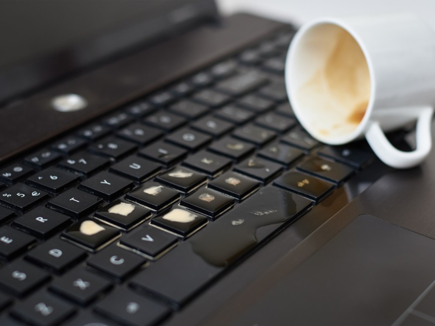 a coffee cup spill on the laptop
