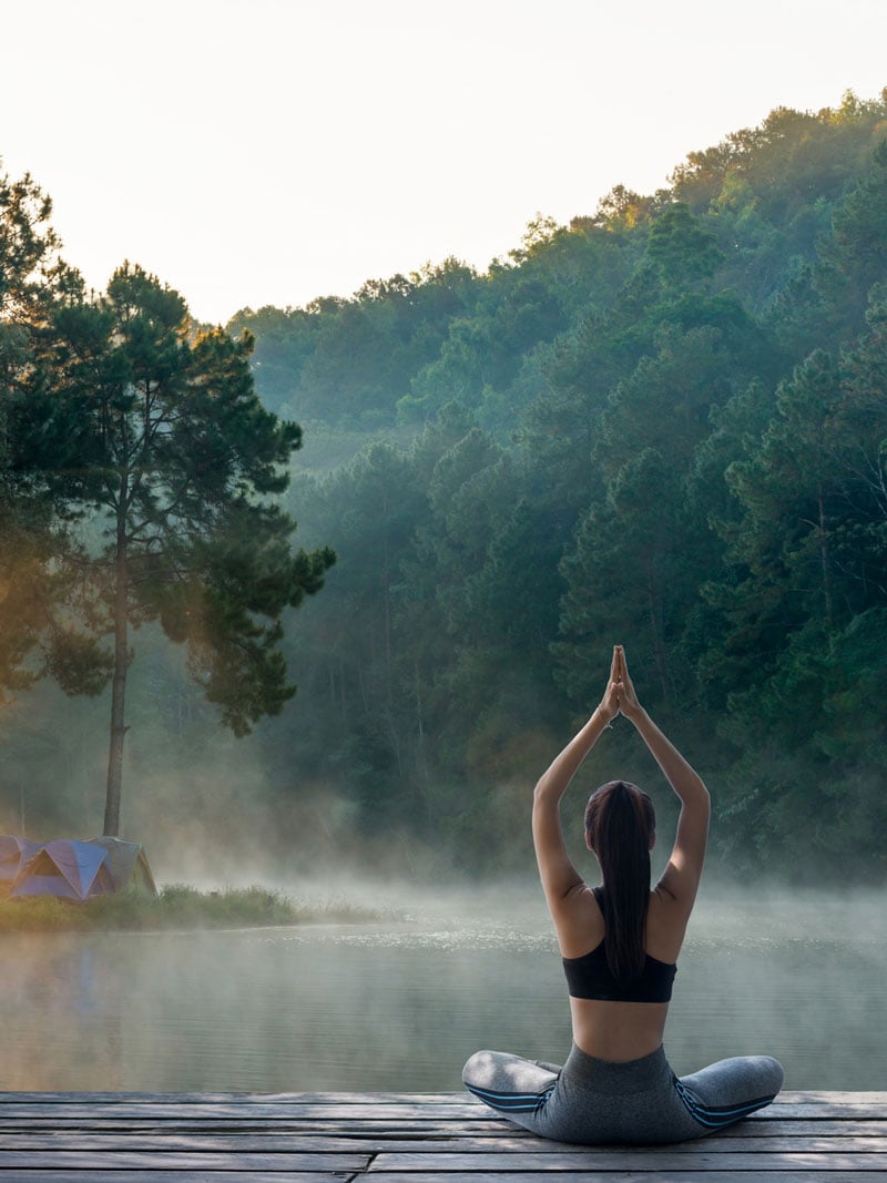 mountain water with girl doing yoga