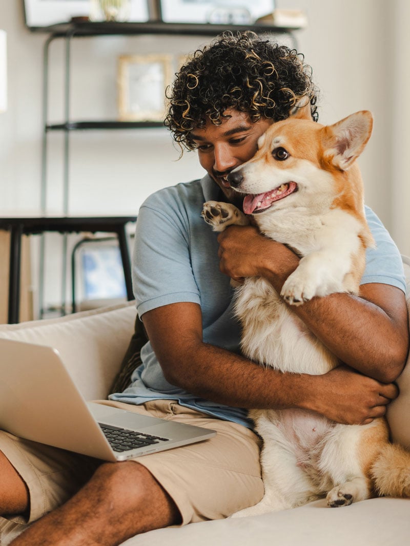 man hugging dog