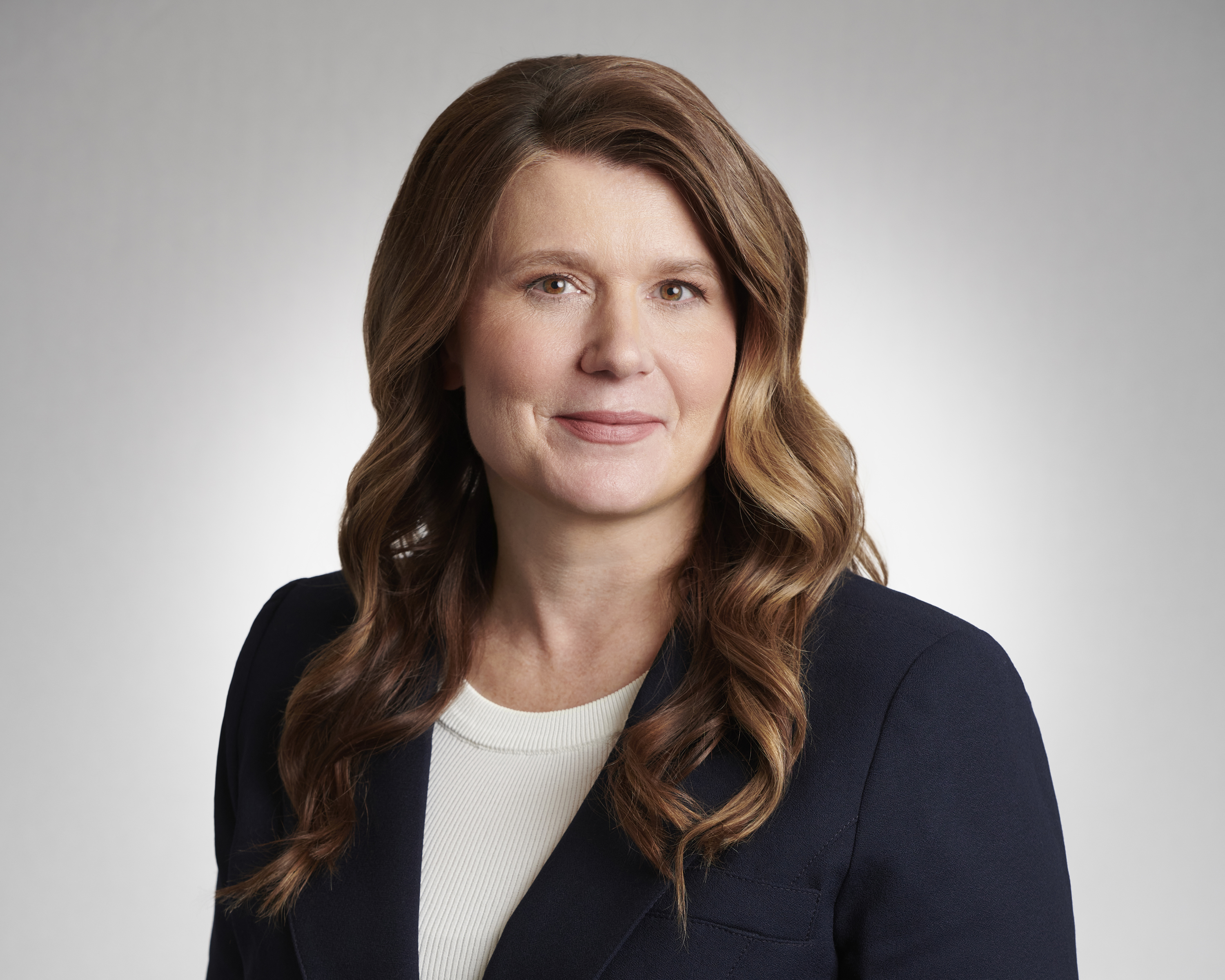 Joanne Bradley shown from shoulders up with a professional demeanor