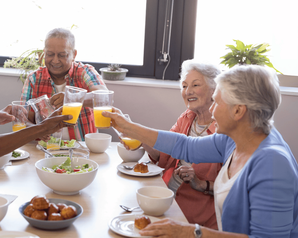 retireed people cheering at breakfast