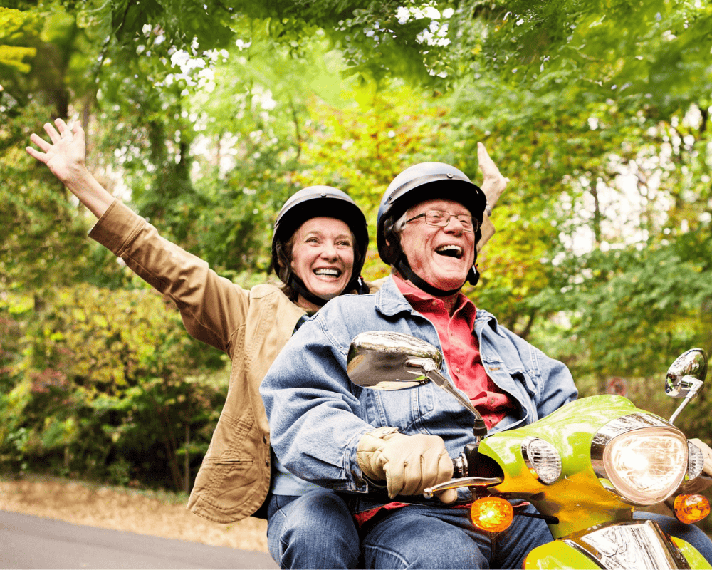 Happy Senior Couple on Scooter