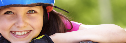 Safe child wearing a helmet
