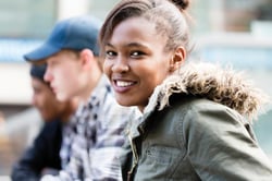 Teen girl smiling. Children's Wisconsin mental health resources for teens.
