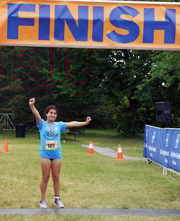 Jolie of Team Survivor at the finish line