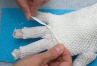 Second layer of gauze on the hand