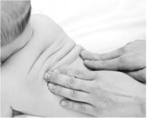 Baby getting a back massage from parent