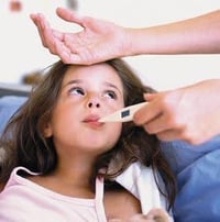 Photo of child getting her temp taken