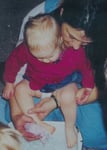 mother washing child's foot