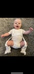child on their back in harness