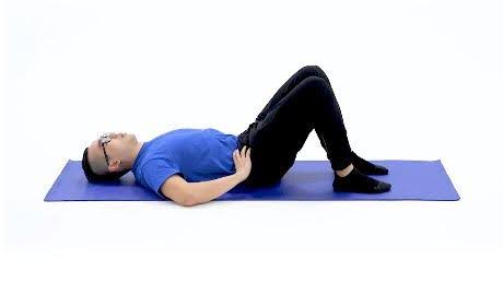 man on mat Abdominal Bracing