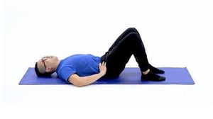 man on mat Abdominal Bracing