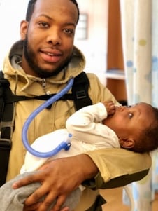 man holding child
