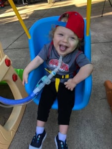 child in swing