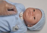 cpr being done on doll with trach