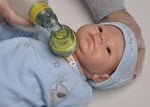 cpr being done on doll with trach
