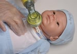 cpr being done on doll with trach