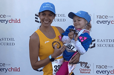 Avery and her mom after a race
