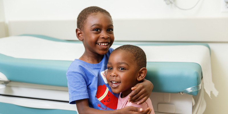 Two young male patients in exam room