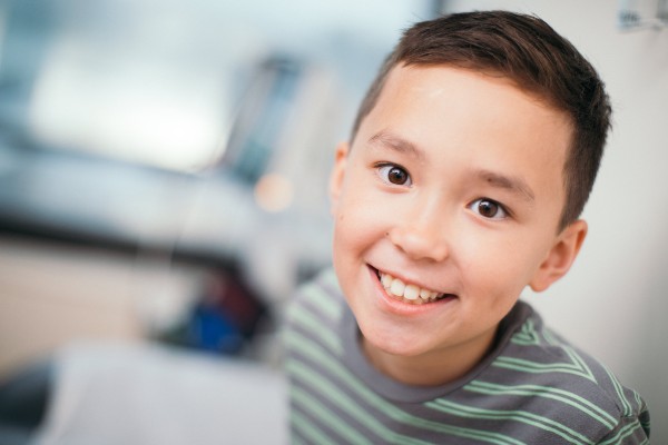 Smiling boy looking up at camera