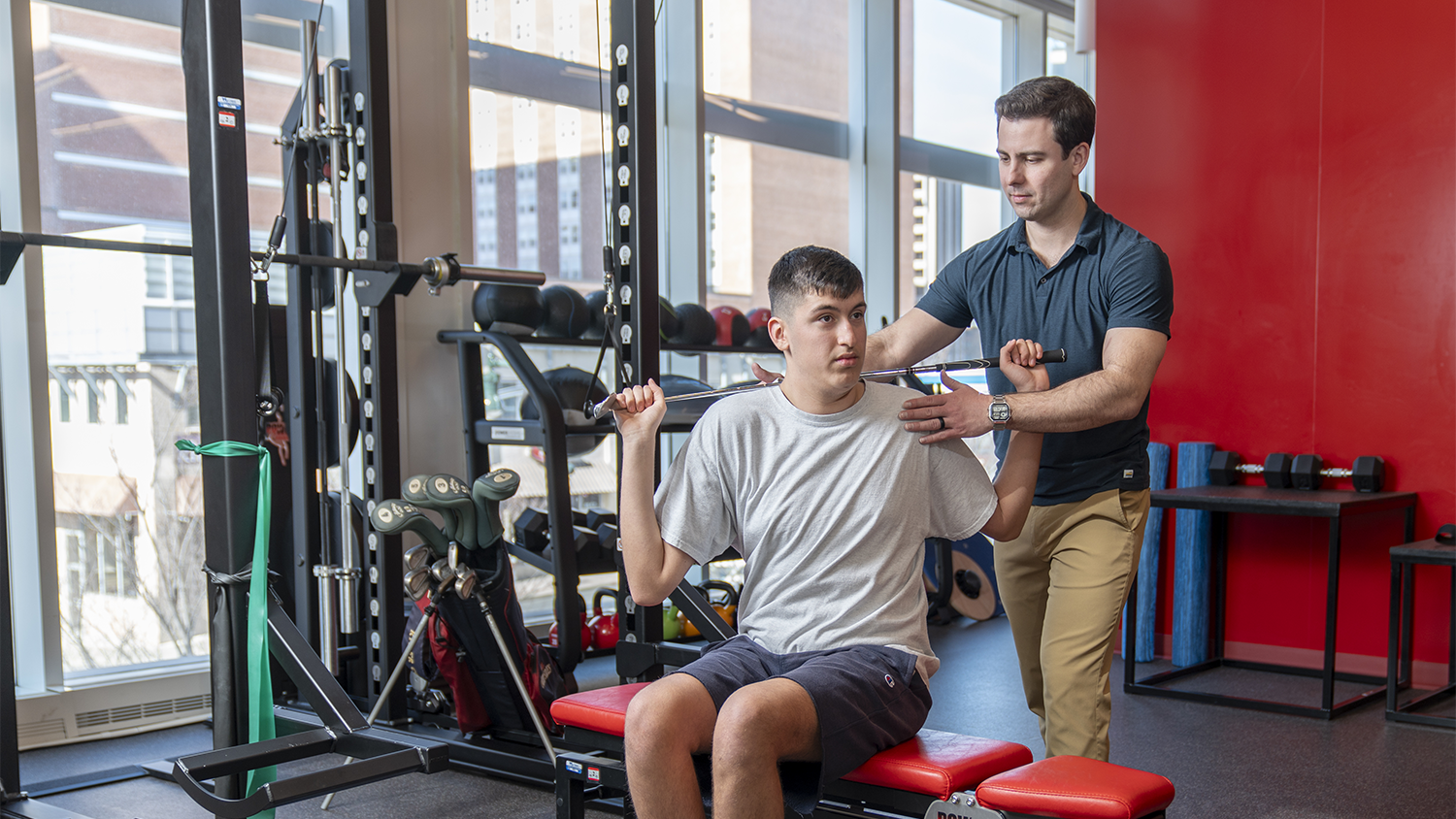 Dr. McGuinness working with a patient for sports performance assistance.