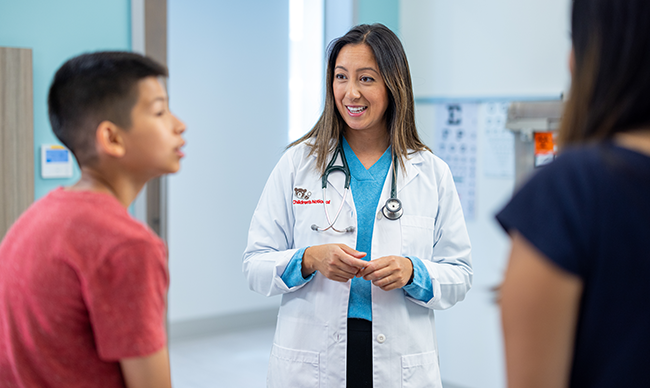 Dr. Carolina speaking with kids