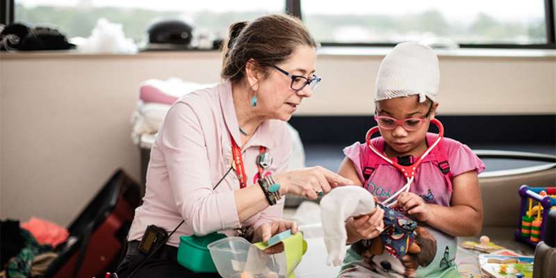 Provider and patient playing with toys