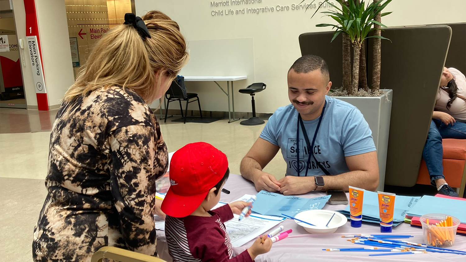 Child and mom working on a science project