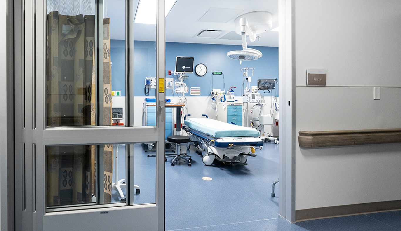 Patient room with a specialized bed and overhead light