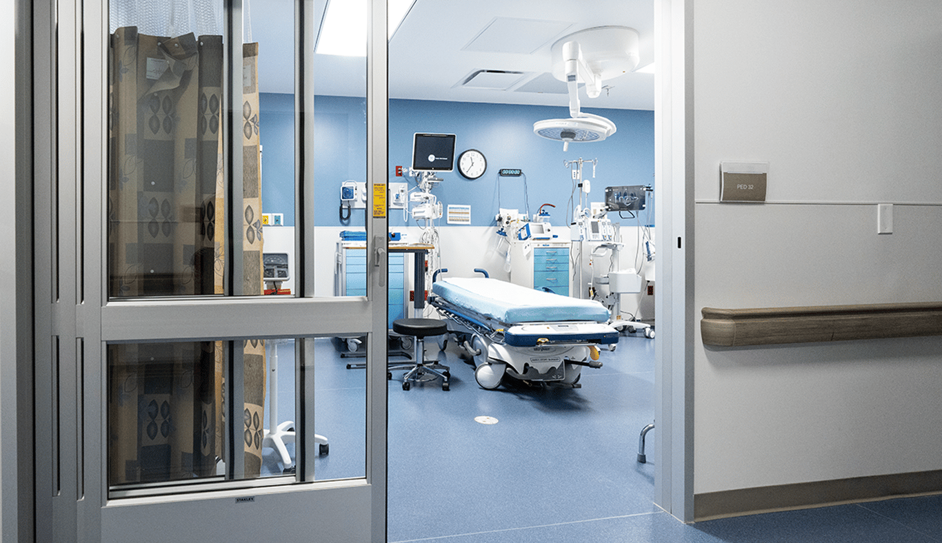 Patient room with a specialized bed and overhead light