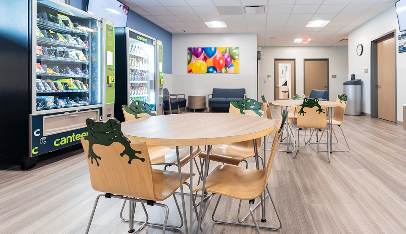 Waiting area with table and vending machines