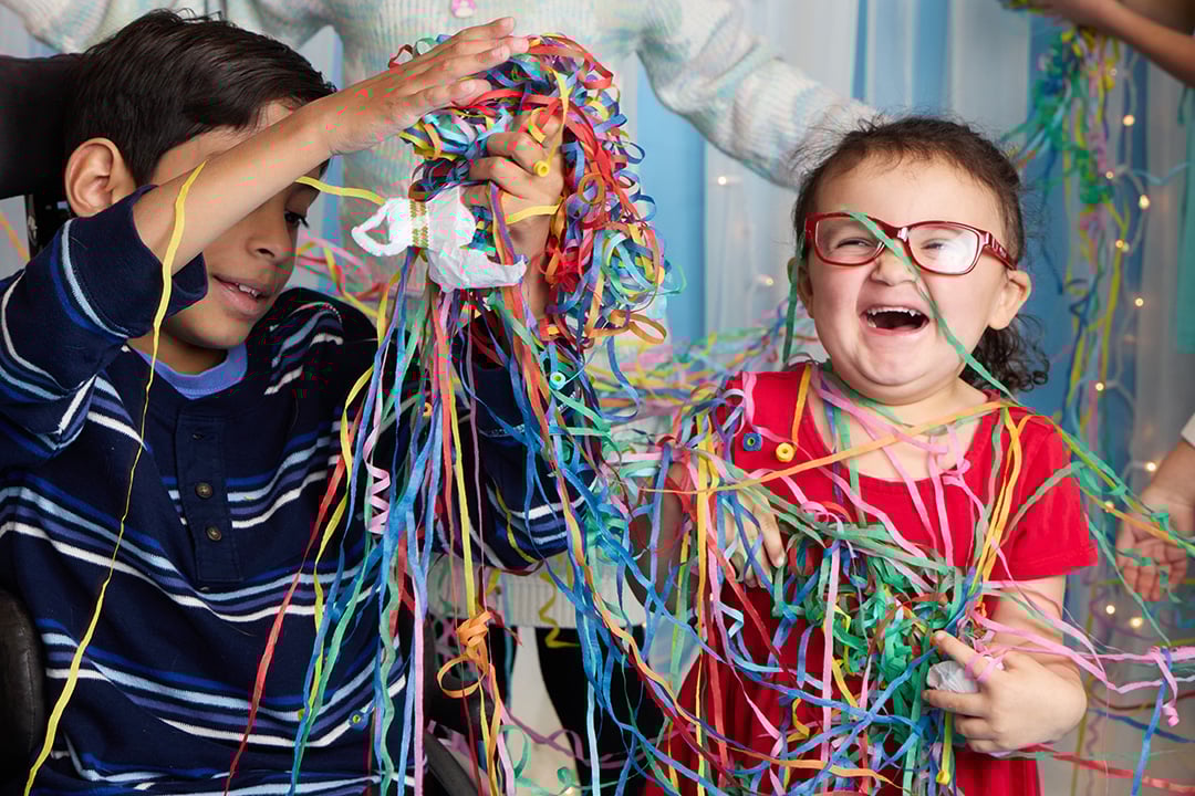 Children playing with streamers